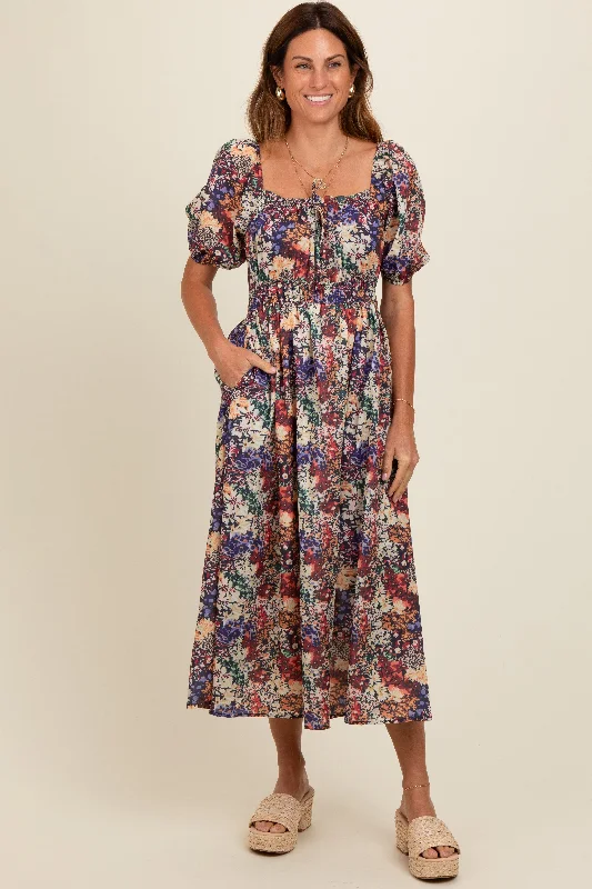 Iconic women’s outfits that never go out of style   Black Floral Puff Sleeve Midi Dress