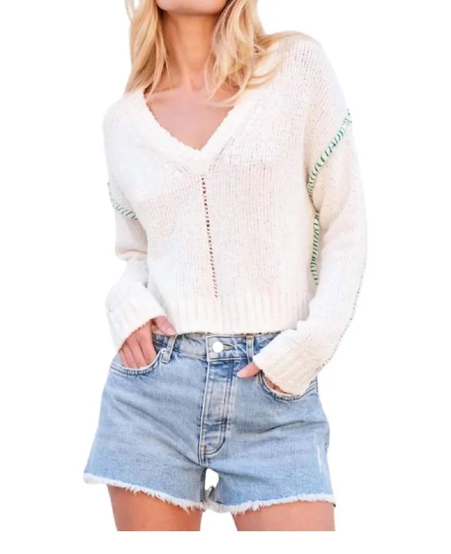 Iconic women’s outfits that never go out of style   V-Neck Sweater In Cream